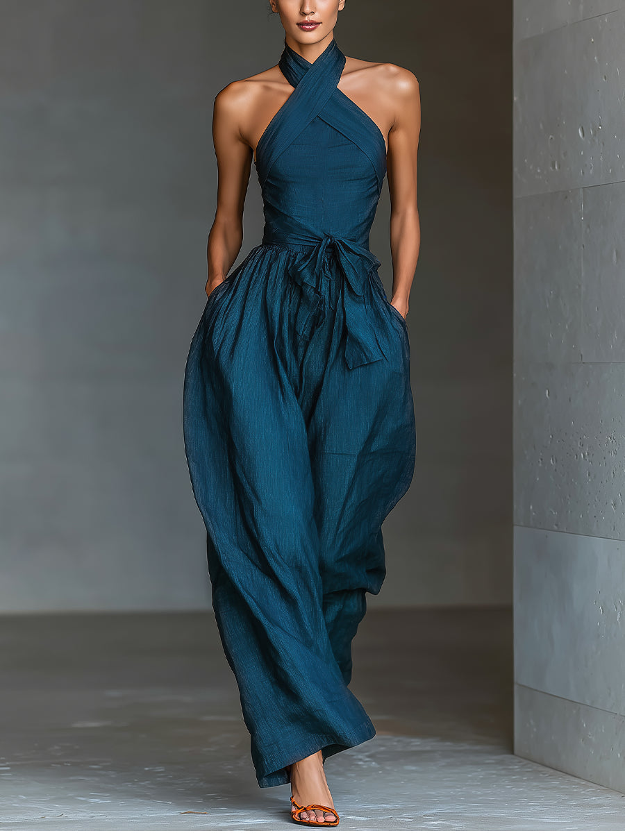 Tuta blu navy con scollo halter incrociato e gamba ampia