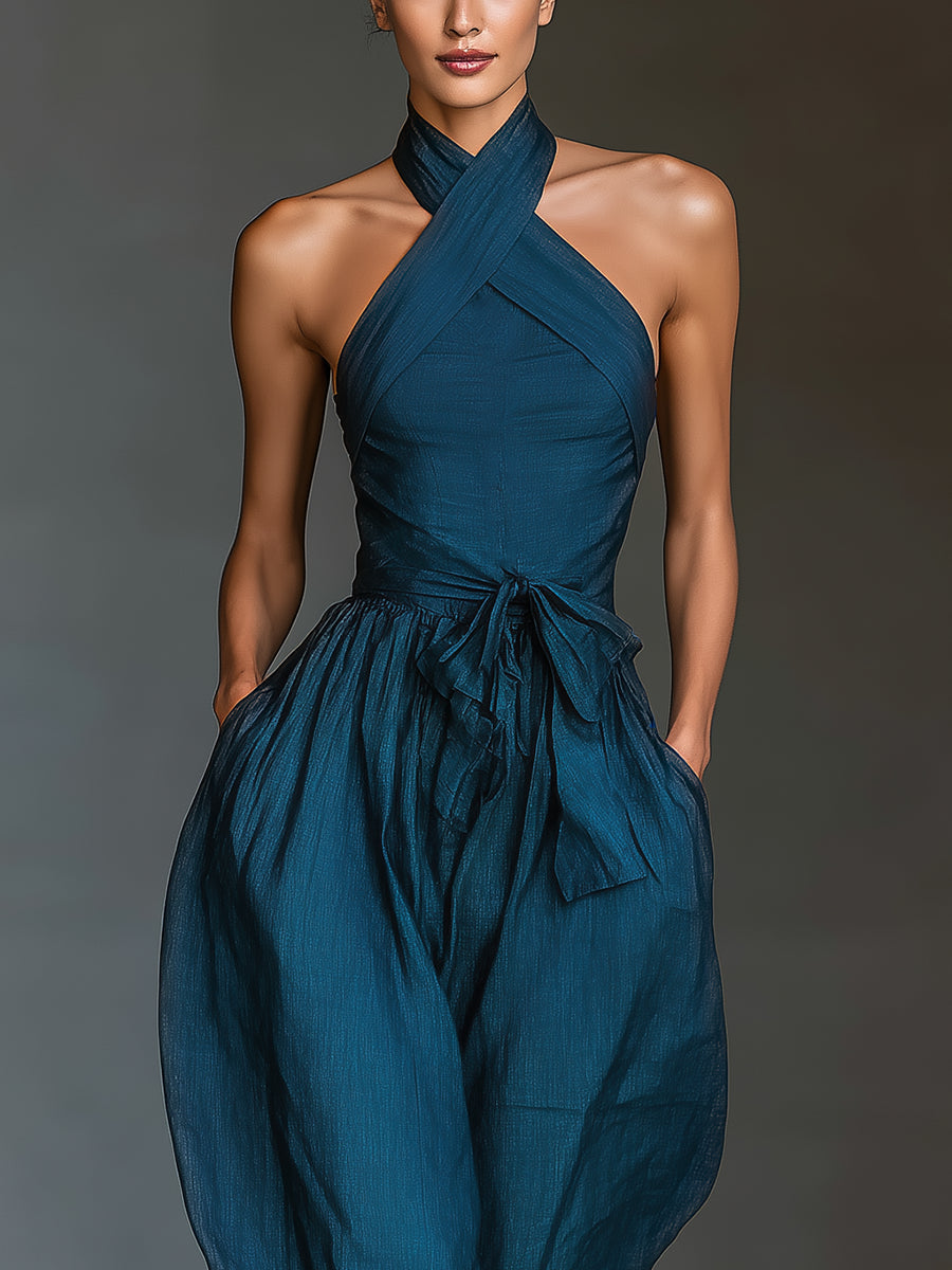 Tuta blu navy con scollo halter incrociato e gamba ampia